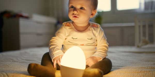 baby on bed with light